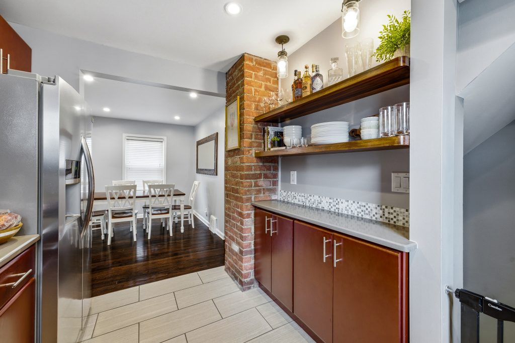 Cozy but functional kitchen within a Royal Oak bungalow. Photo by: Focus Nest Media