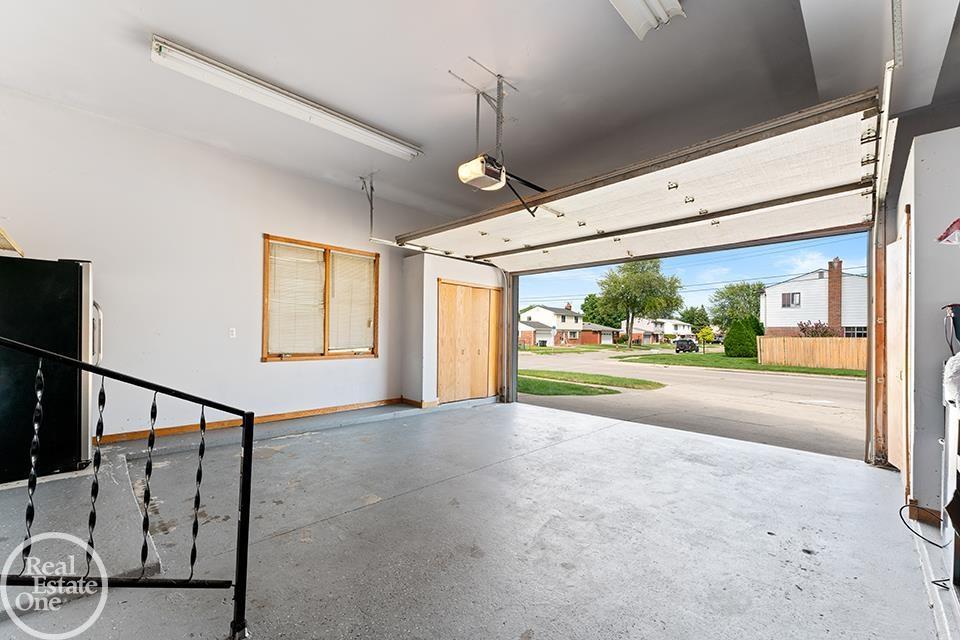 Clean garage attached to a St. Clair Shores colonial. Photo by: Focus Nest Media